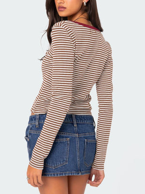 Striped long sleeve Henley shirt with contrast collar and button detail.