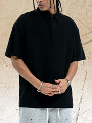 Black cotton polo shirt with buttoned collar and short sleeves