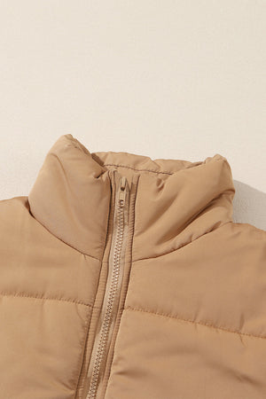 Tan padded sleeveless hooded vest with zipper detail and high collar.