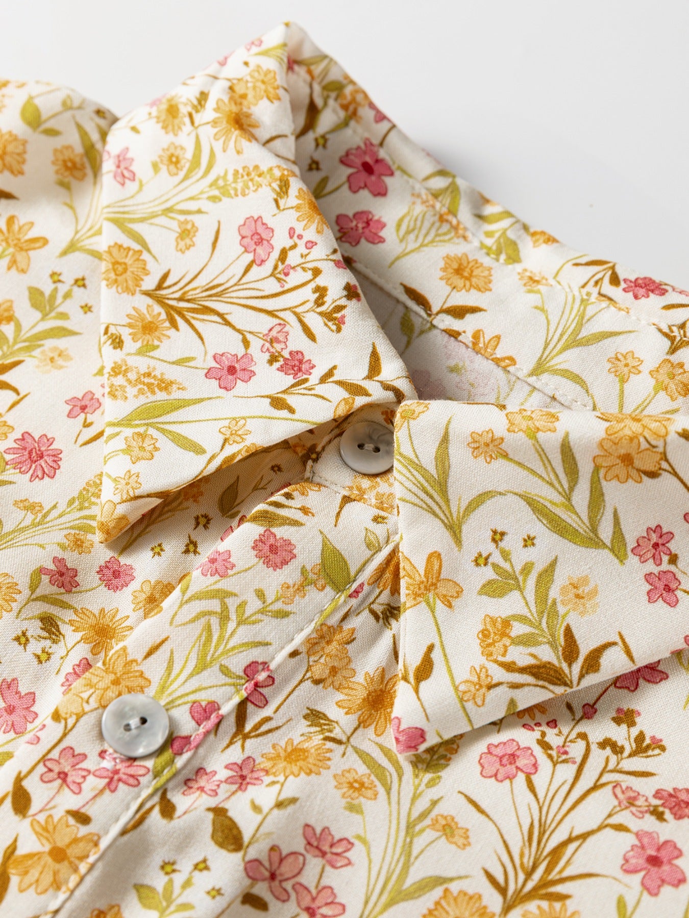 Floral print button-down shirt dress with a collared neckline and buttoned front.