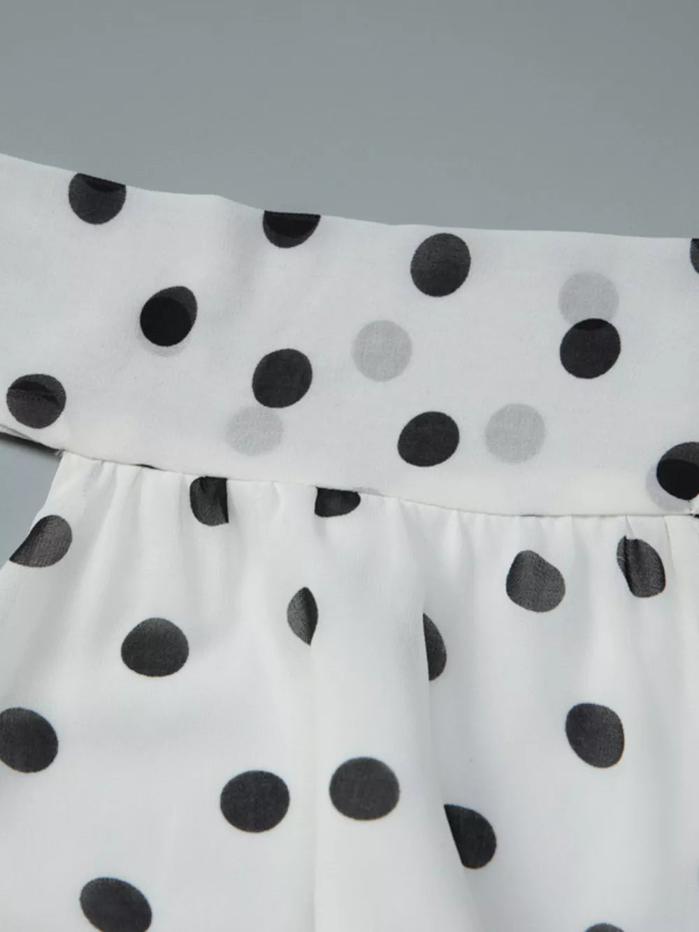 White polka dot halter neck mini dress with ruched detail