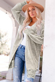 Textured puff sleeve open cardigan in Sand with a knit pattern and long sleeves.