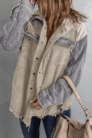 Colorblock corduroy hooded utility jacket with tan and gray panels and frayed hem.