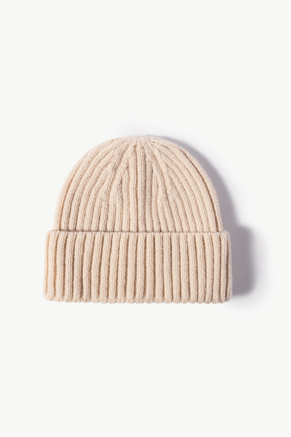 Chunky ribbed knit beanie in cream acrylic with a cuffed hem.