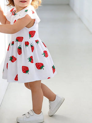 Baby girl's white cotton dress with allover red strawberry print and ruffle sleeves.