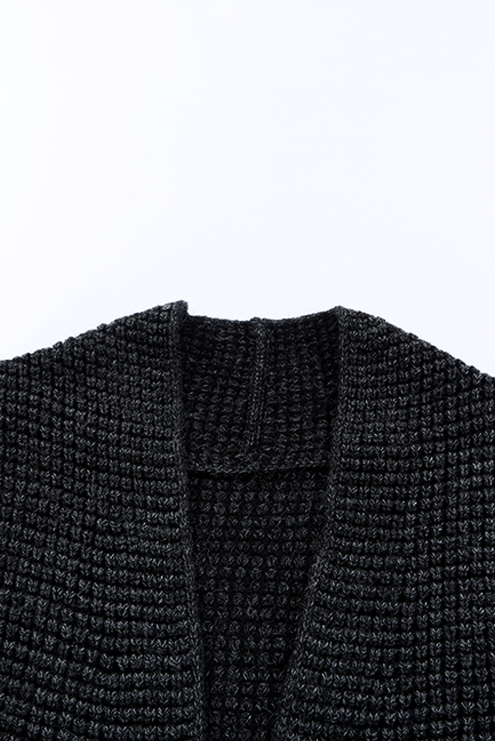 Textured acrylic open cardigan in black with a waffle knit pattern.