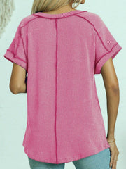 Pink ribbed V-neck tee with contrast stitching and cuffed short sleeves.