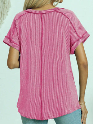Pink ribbed V-neck tee with contrast stitching and cuffed short sleeves.