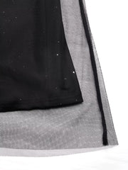 Black midi dress with glitter detail and sheer tulle overlay.