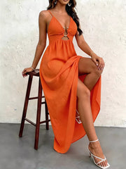Orange maxi dress with cutout, O-ring detail, spaghetti straps, and high slit.