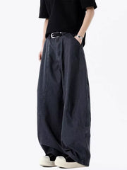 Men's grey vintage wide-leg sweatpants with a relaxed fit and modern stitching.