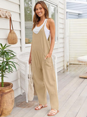 Khaki relaxed pocketed overalls jumpsuit with V-neck and wide legs.