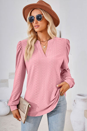 Textured puff sleeve henley blouse in blush pink with V-neck and long sleeves