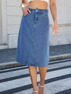 Panel-seam denim midi skirt in light blue with front pockets and a-line cut.