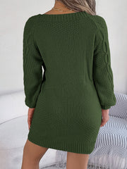 Dark Green cable knit mini dress with long sleeves and a belted detail.