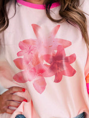 Colorblock floral t-shirt in watermelon pink with a crew neck and short sleeves, featuring a large pink floral print.