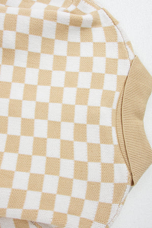 Tan and white checkerboard knit polo sweater with ribbed cuffs.