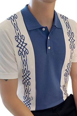 Embroidered panel polo shirt in dusty blue and white with ornate blue embroidery details.