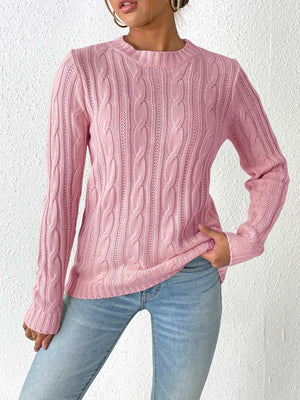 Dusty Pink cable knit sweater with crew neck and long sleeves.