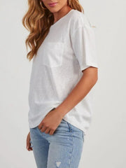 White linen boxy tee with patch pocket and short sleeves.