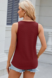 Perforated knit v-neck tank top in rust with a diamond pattern.