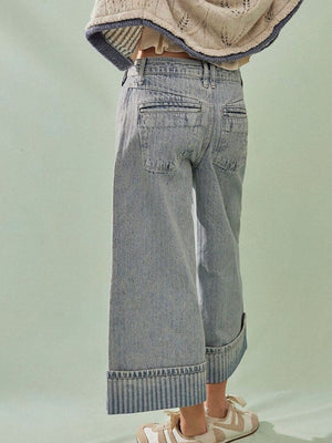 Light blue cotton blend cropped jeans with wide leg and cuffed hem.