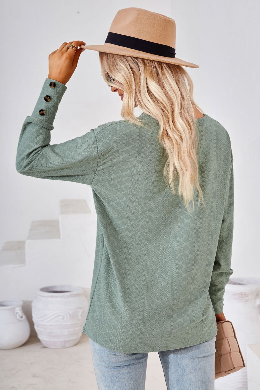 Sage green textured V-neck blouse with button cuff detail