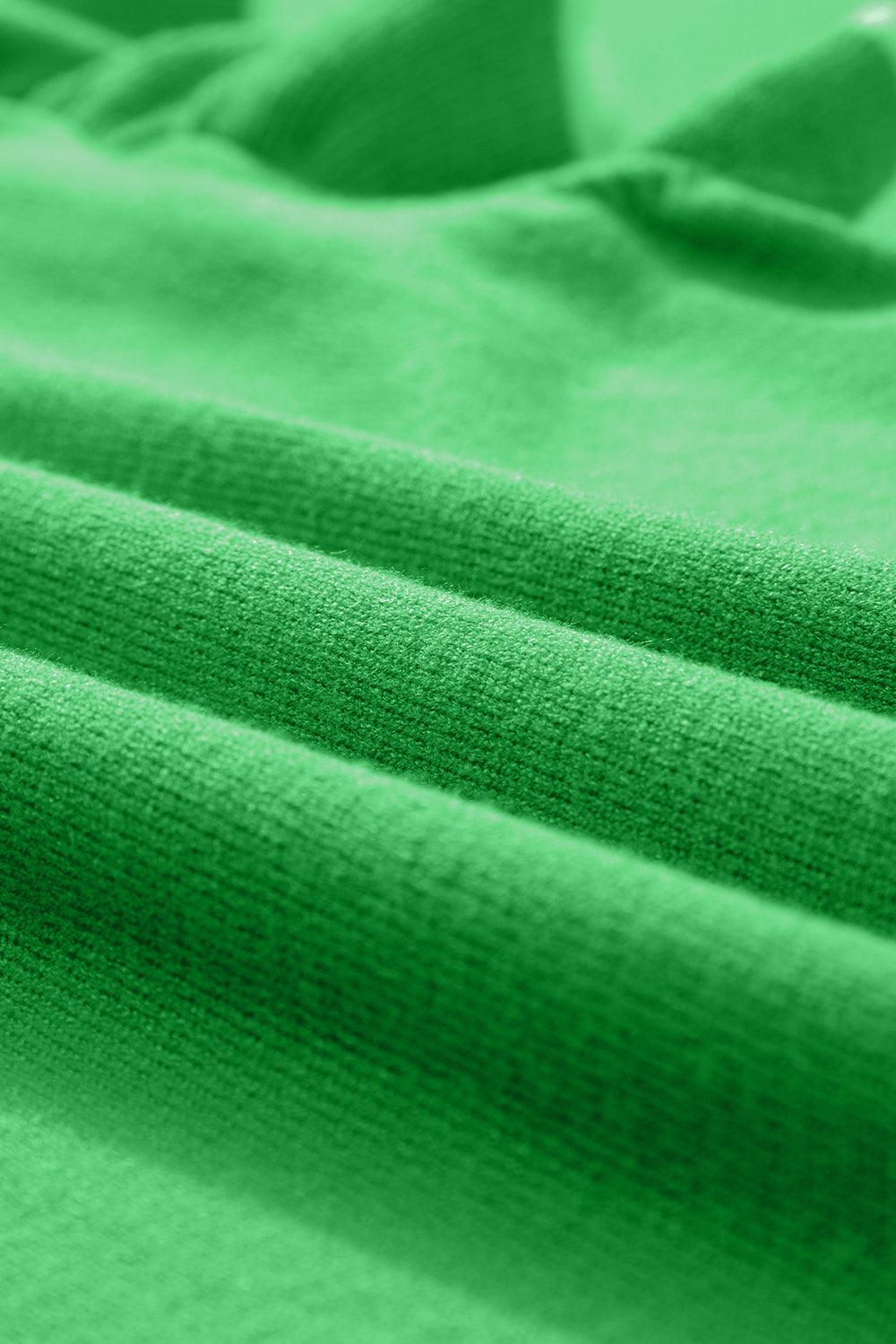 Green knit cardigan with ruffled sleeves and contrast trim detail