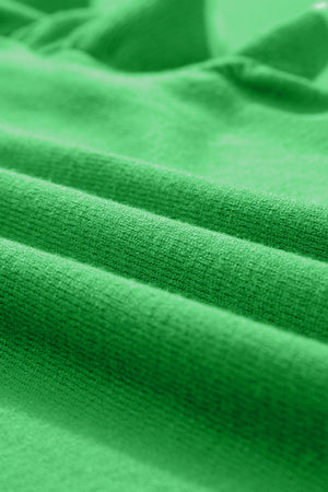 Green knit cardigan with ruffled sleeves and contrast trim detail