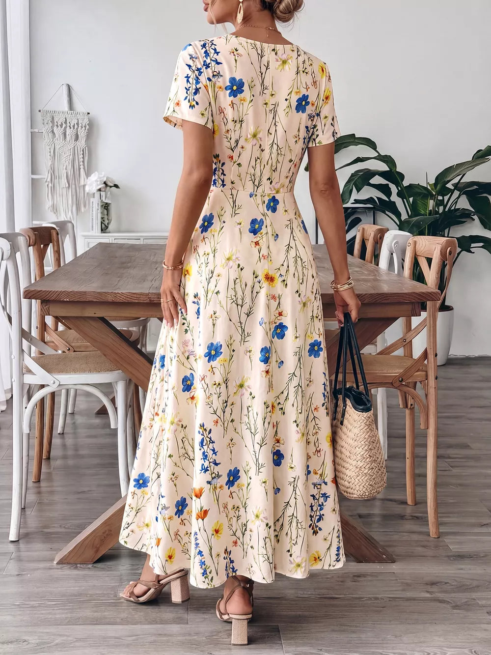 A-line maxi dress with short sleeves, square neckline, and a cream floral print.