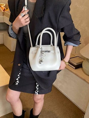 Leather Crossbody Bag With Lock Detail in White, close-up detail