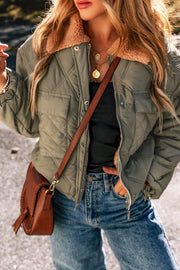 Quilted utility jacket in sage with shearling collar, snap pockets, and zipper.