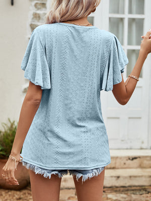 Light blue eyelet flutter sleeve blouse with textured pattern.