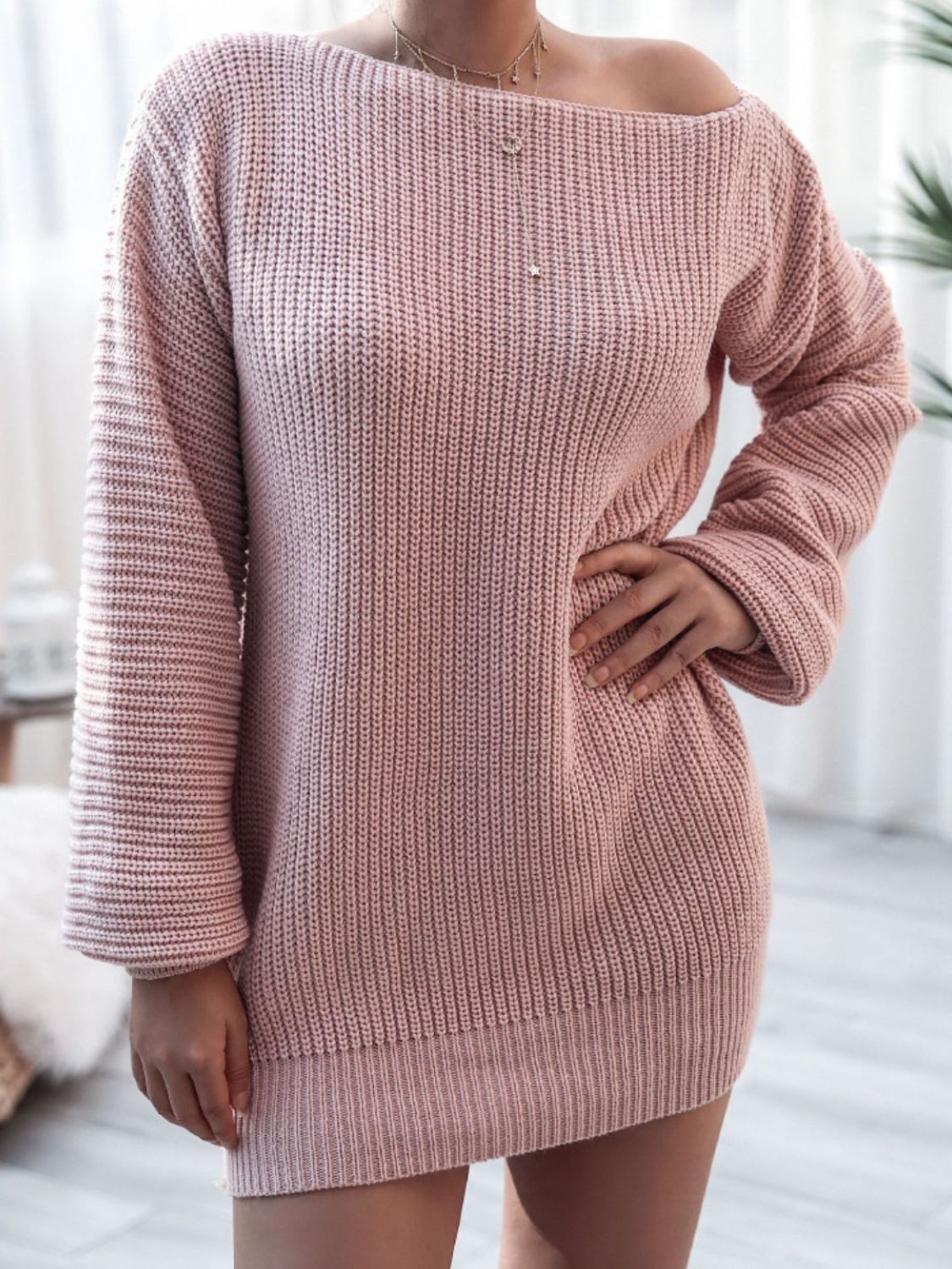 Light mauve acrylic sweater dress with balloon sleeves and off-the-shoulder neckline