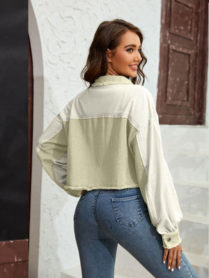 Textured colorblock cropped jacket in matcha green and cream with raw edges and balloon sleeves.