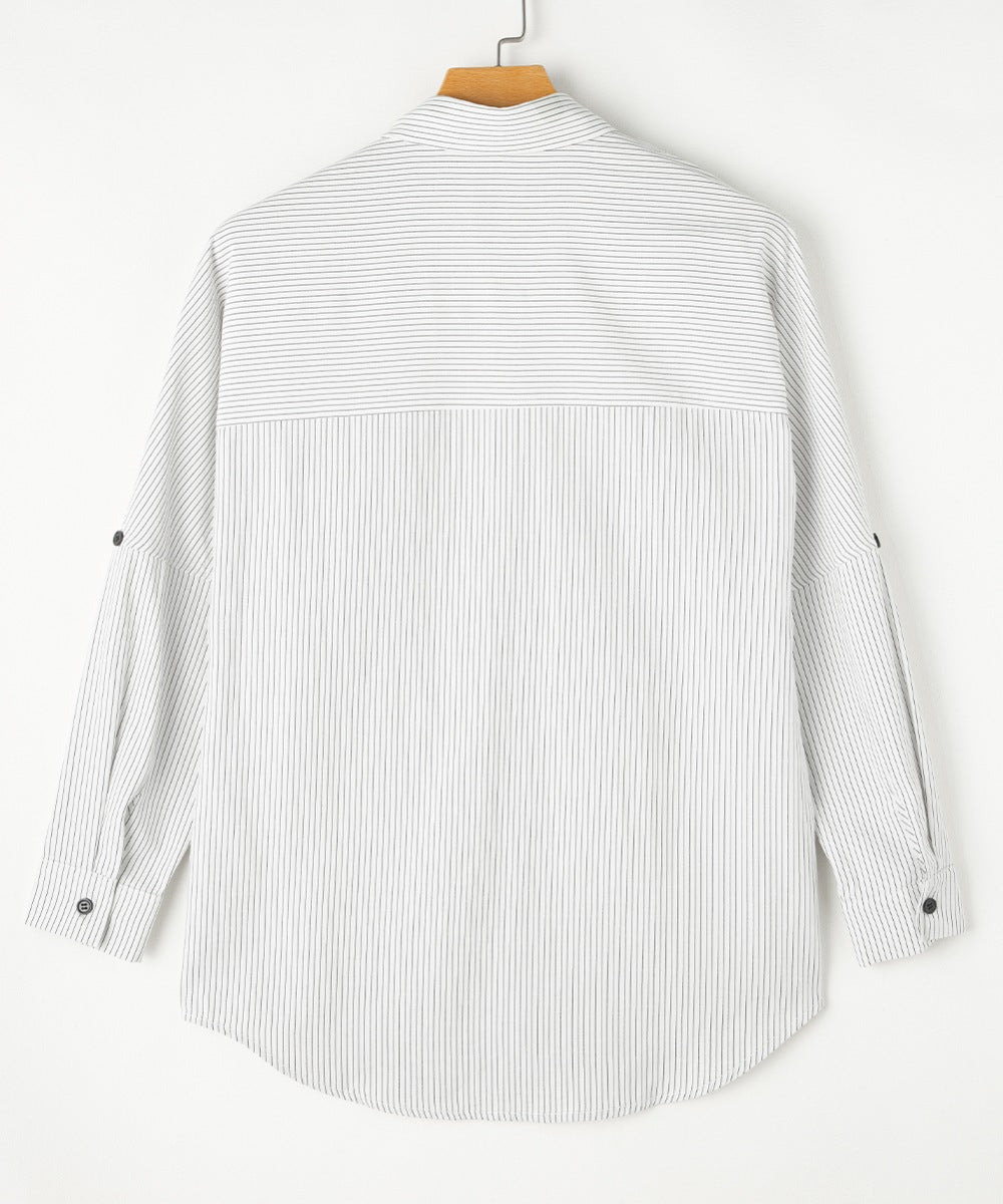 Relaxed white button-down shirt with subtle vertical pinstripes and roll-tab sleeves.