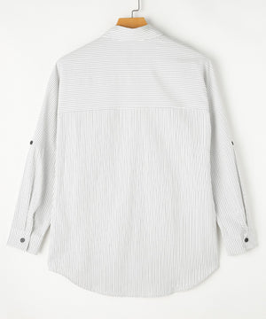 Relaxed white button-down shirt with subtle vertical pinstripes and roll-tab sleeves.