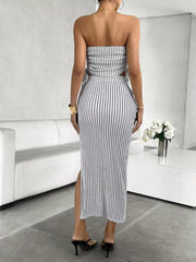 Black and white striped tube top and slit maxi skirt set with cutouts.