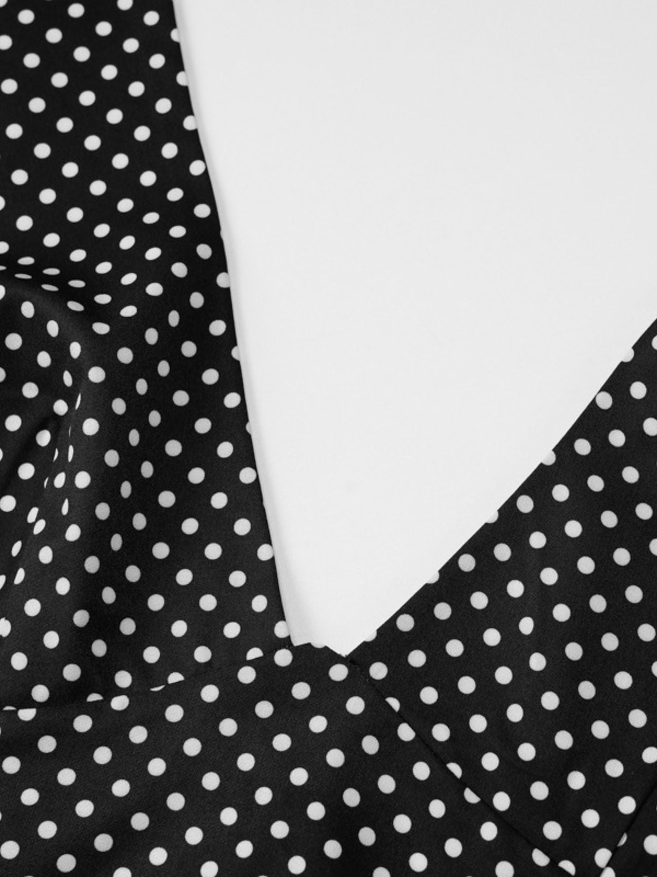 Black polka dot maxi dress with halter neckline detail