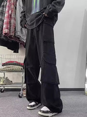Black cargo pants with multiple large pockets and a relaxed fit.