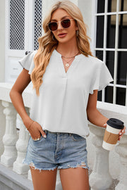 White flutter sleeve V-neck blouse with a relaxed fit and casual styling.