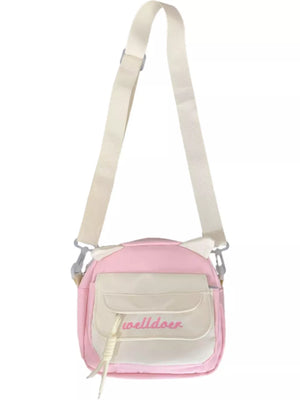 Pink crossbody bag with cat ears and adjustable strap