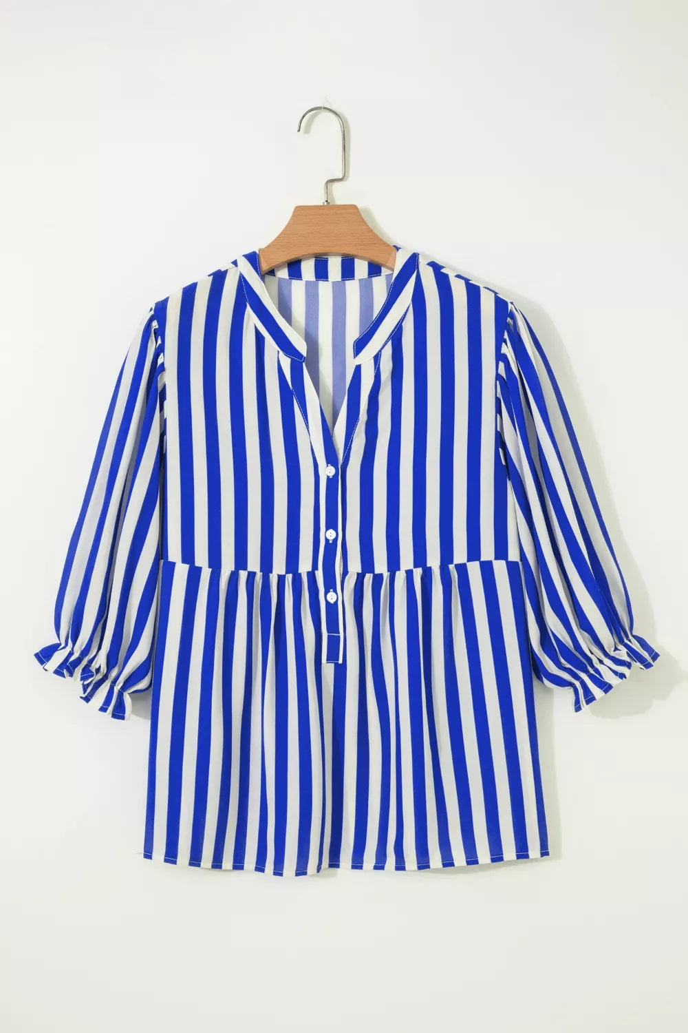 Blue and white striped button-down shirt with balloon sleeves and a tiered hem.