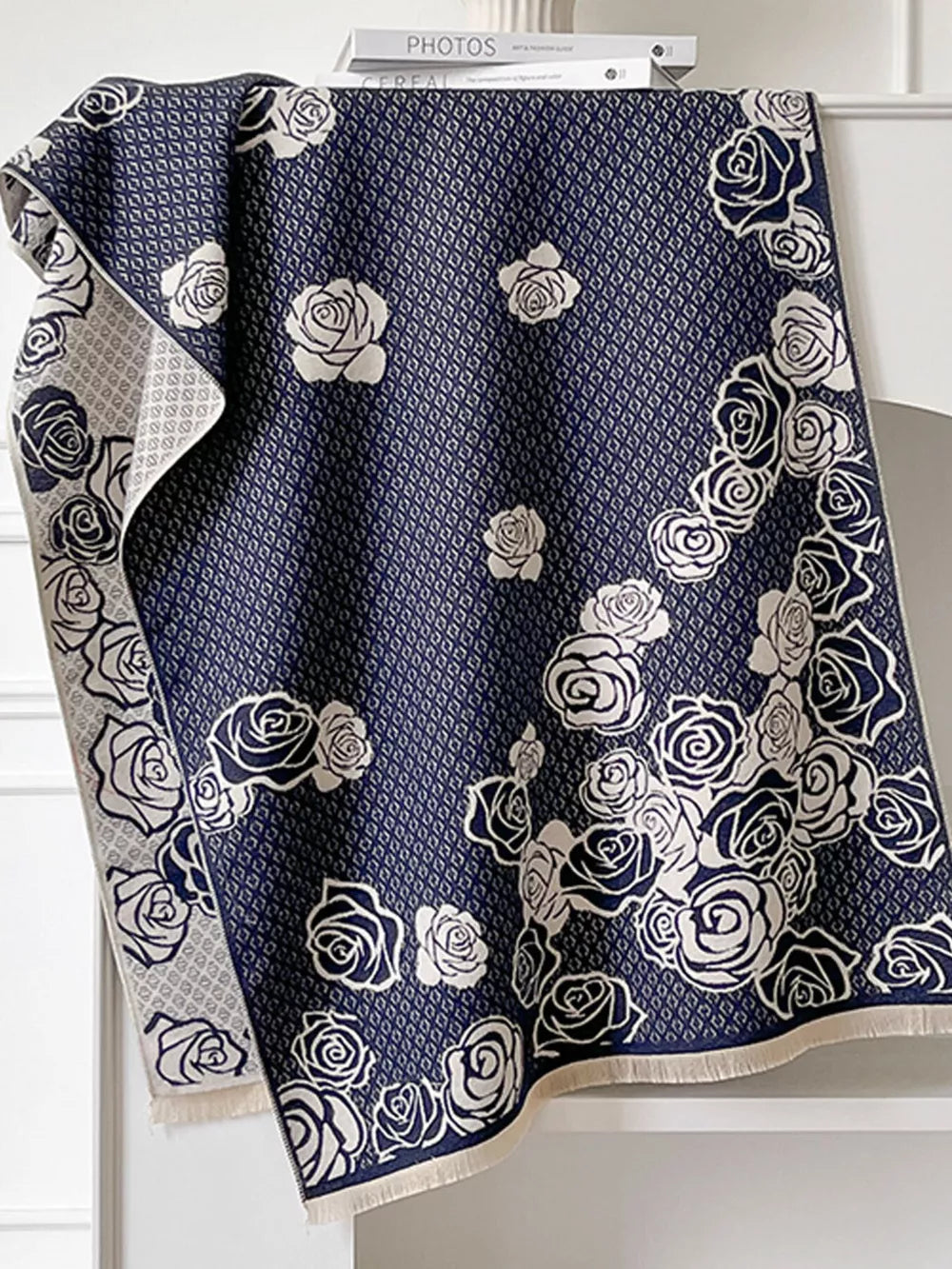 Navy blue scarf with white roses and diamond pattern, fringed edges