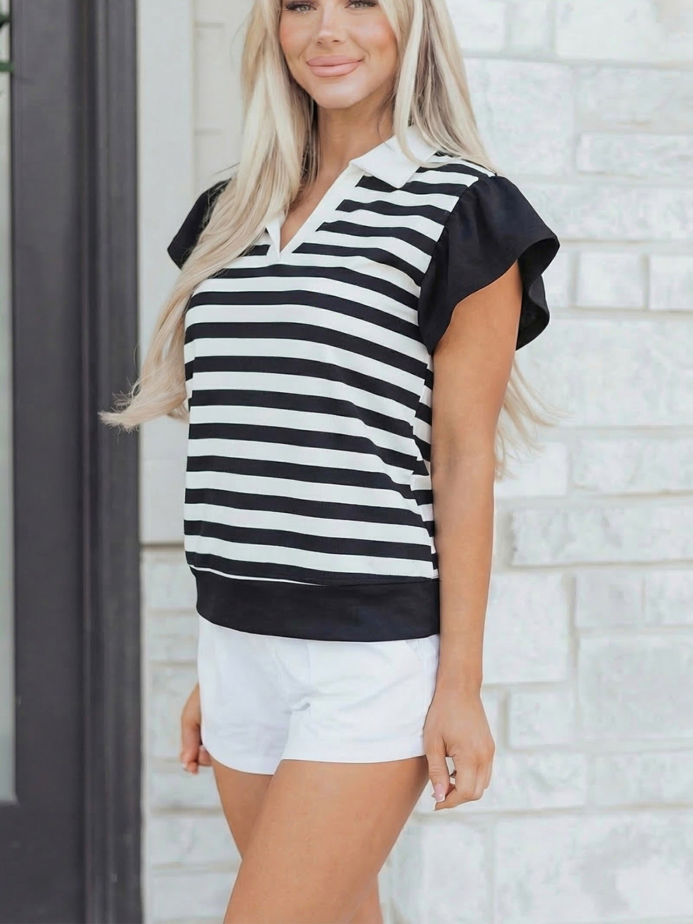 Black and white striped cotton blouse with ruffled sleeves and a collar