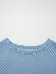 Light blue textured drawstring set with a geometric pattern and crew neck.