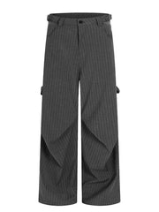 Men's grey pinstripe wide-leg sweatpants with pockets and adjustable waist tabs.