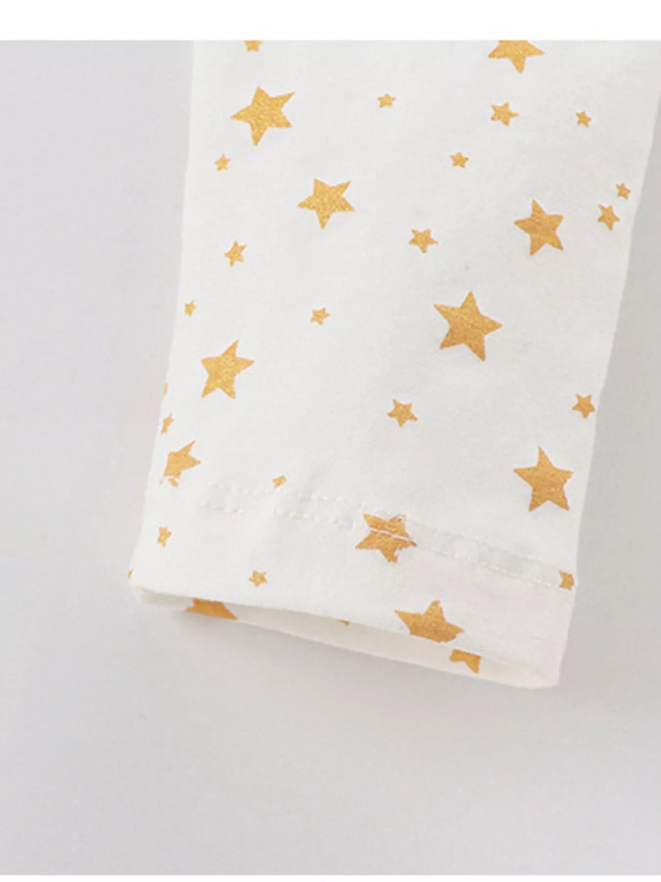 White cotton pajama sleeve with gold star print