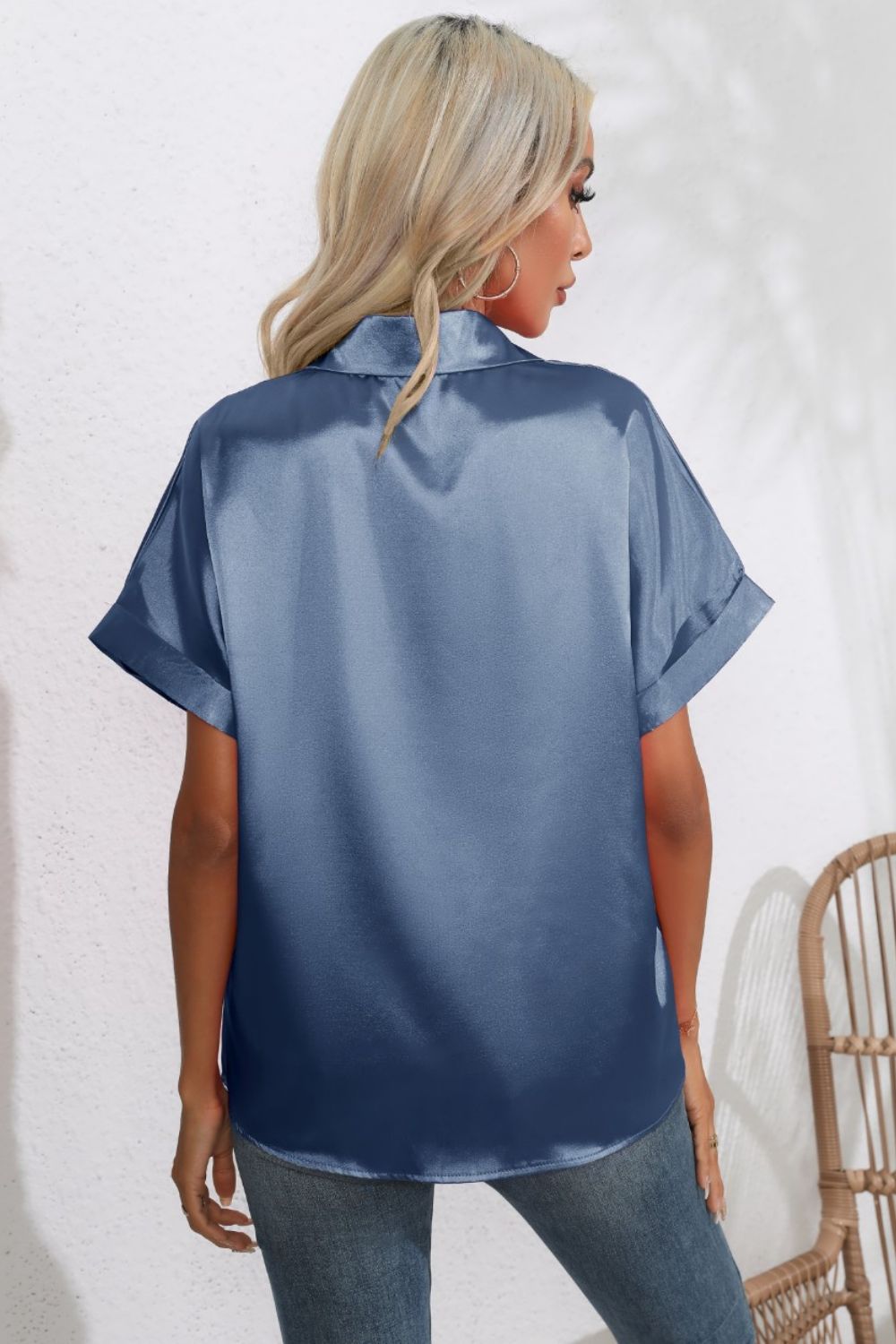 Light blue satin cuffed sleeve button-down blouse with a relaxed fit.