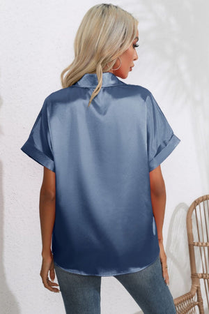 Light blue satin cuffed sleeve button-down blouse with a relaxed fit.